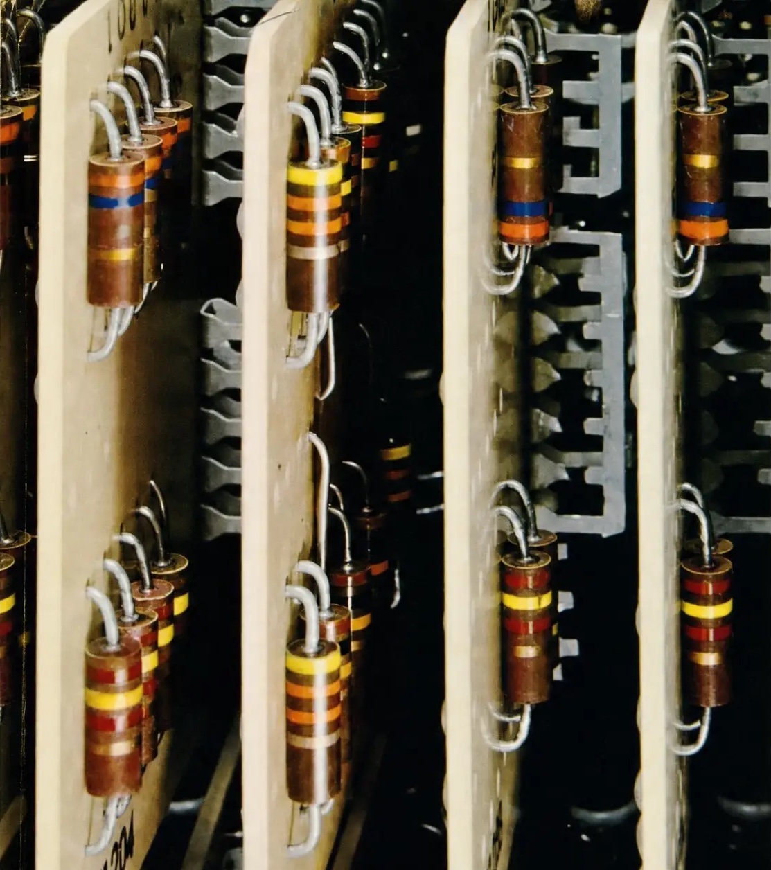 Close-up of vintage circuit boards with rows of colour-banded resistors